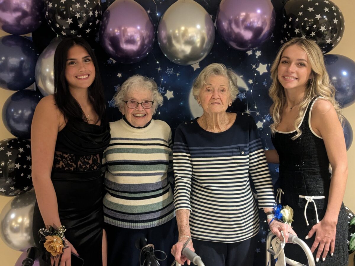 Two teens with their Senior Buddies at Prom